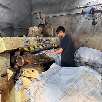 Workers processing leather